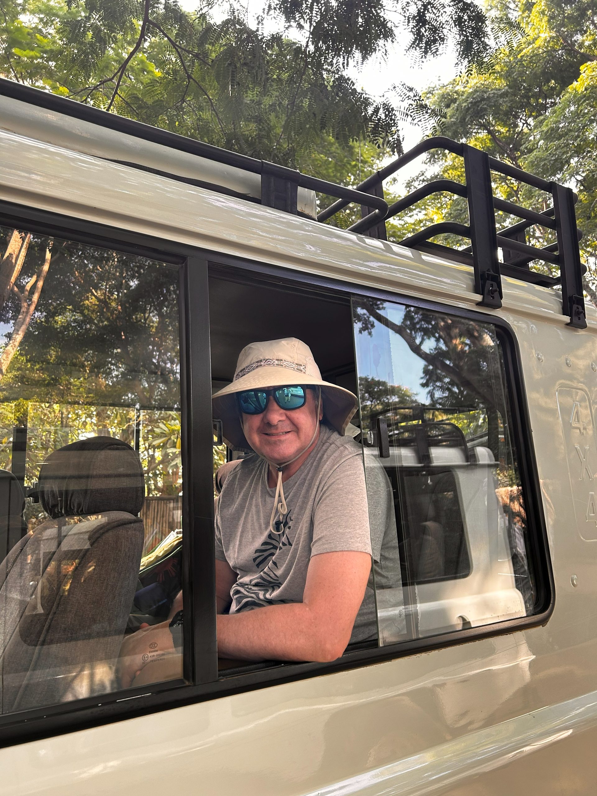 Robert smiling from safari truck window